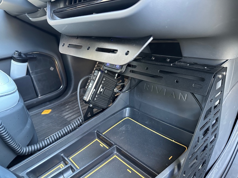 Electrified Overland upper MOLLE panel installed above the passenger footwell of a Rivian R1